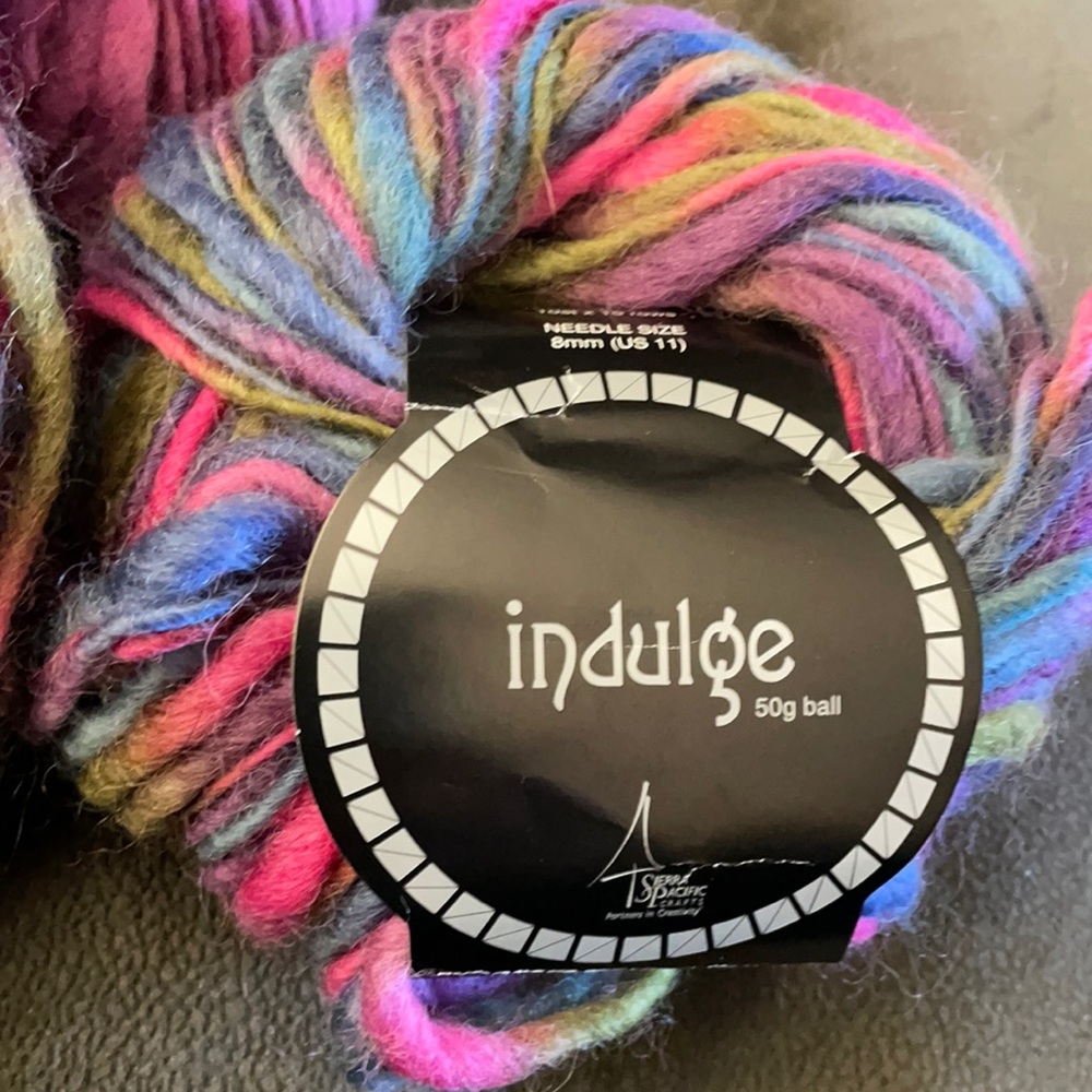 4 skeins of 100% spun variegated wool yarn. About 54 yards per skein. NIP